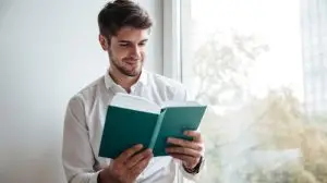 Cheerful,Businessman,Dressed,In,White,Shirt,Sitting,In,Cafe,And