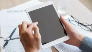 A person is holding a tablet.