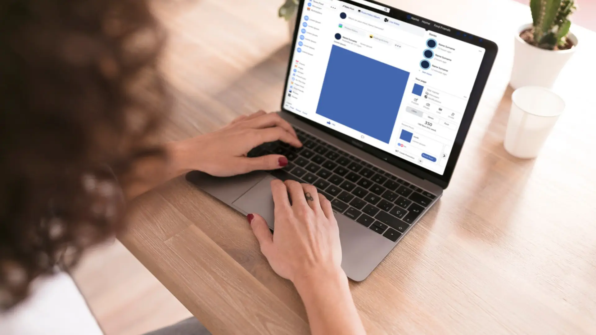 A girl with a laptop is posting in a local Facebook group.