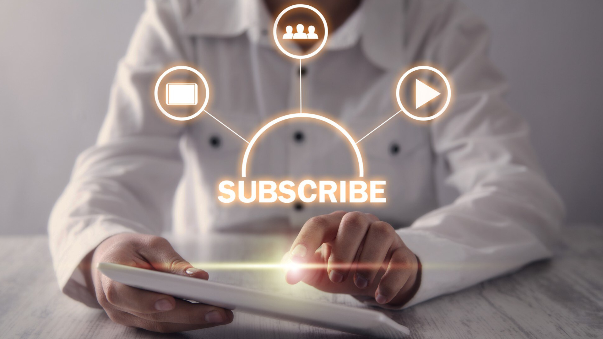 A person is using a tablet that shows her subscription content.