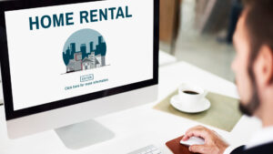 A person is looking at a screen where he is posting a home for a short-term rental.