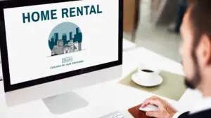 A person is looking at a screen where he is posting a home for a short-term rental.