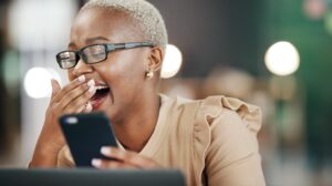 woman laughing on her phone