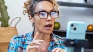 woman recording herself on a phone