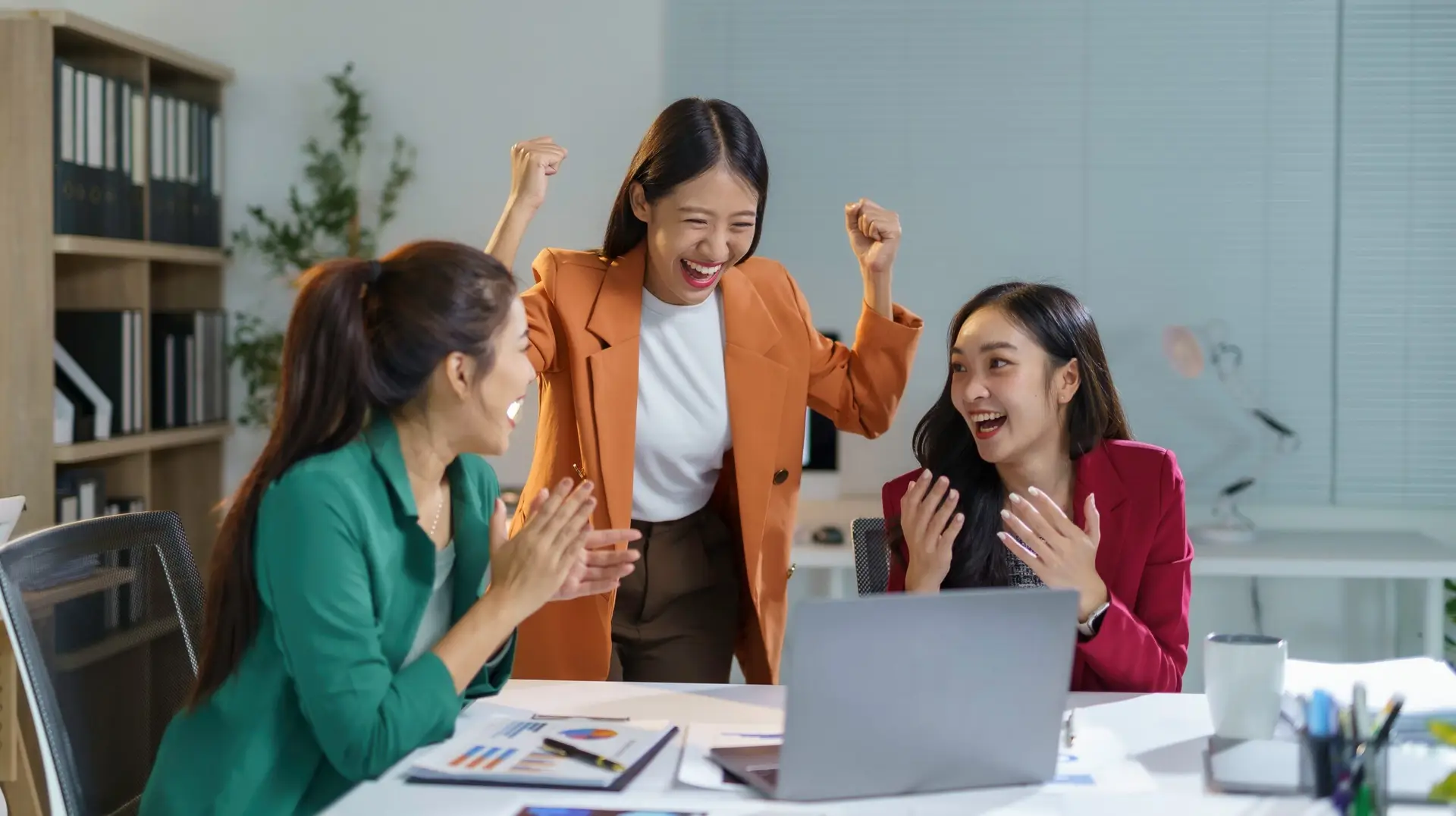 3 marketing girls celebrating