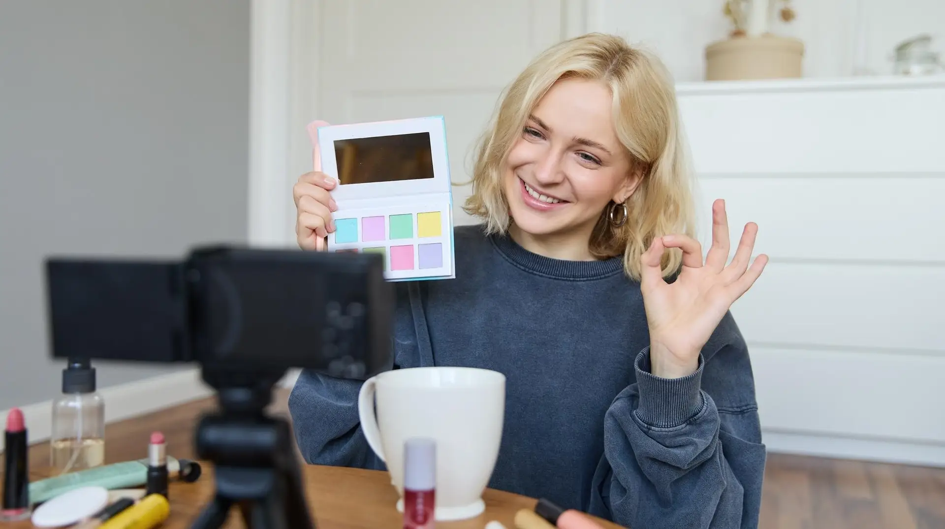 Woman showing a product on camera and rating it