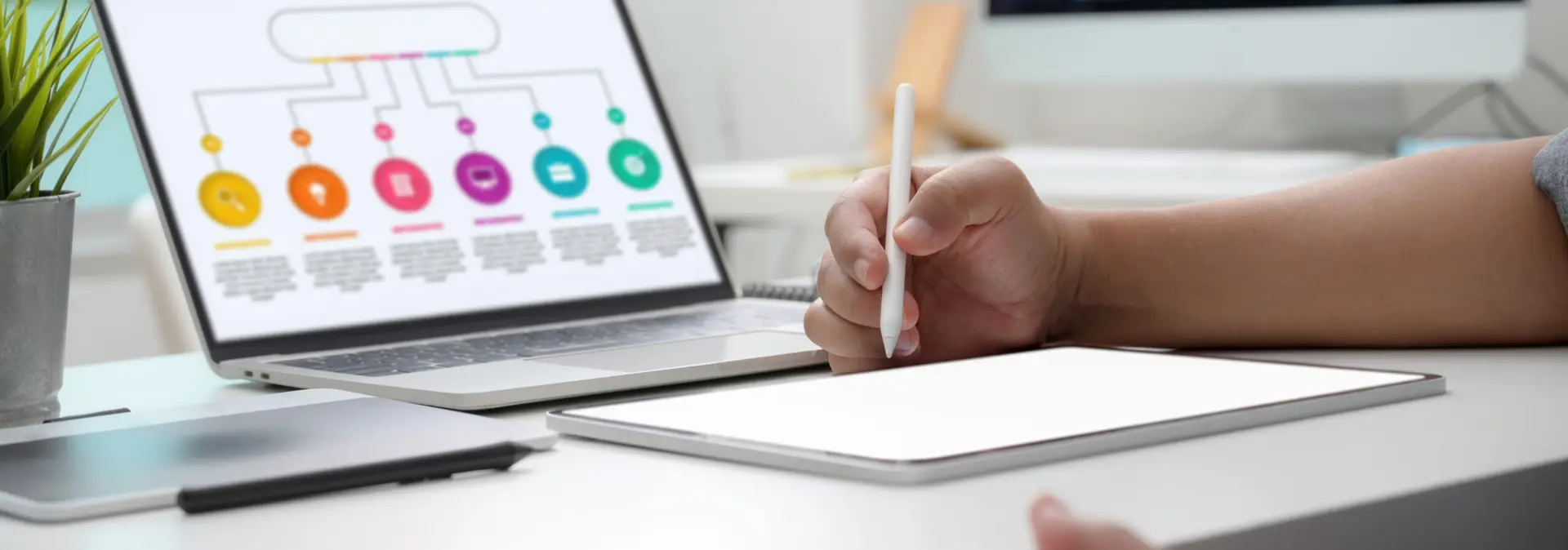 macbook and notebook on a desk