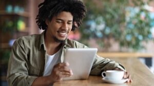man reading in a coffee shop