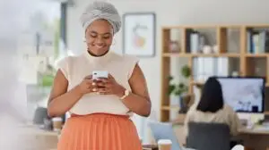 Social Media Influencer In The Office On Her Phone