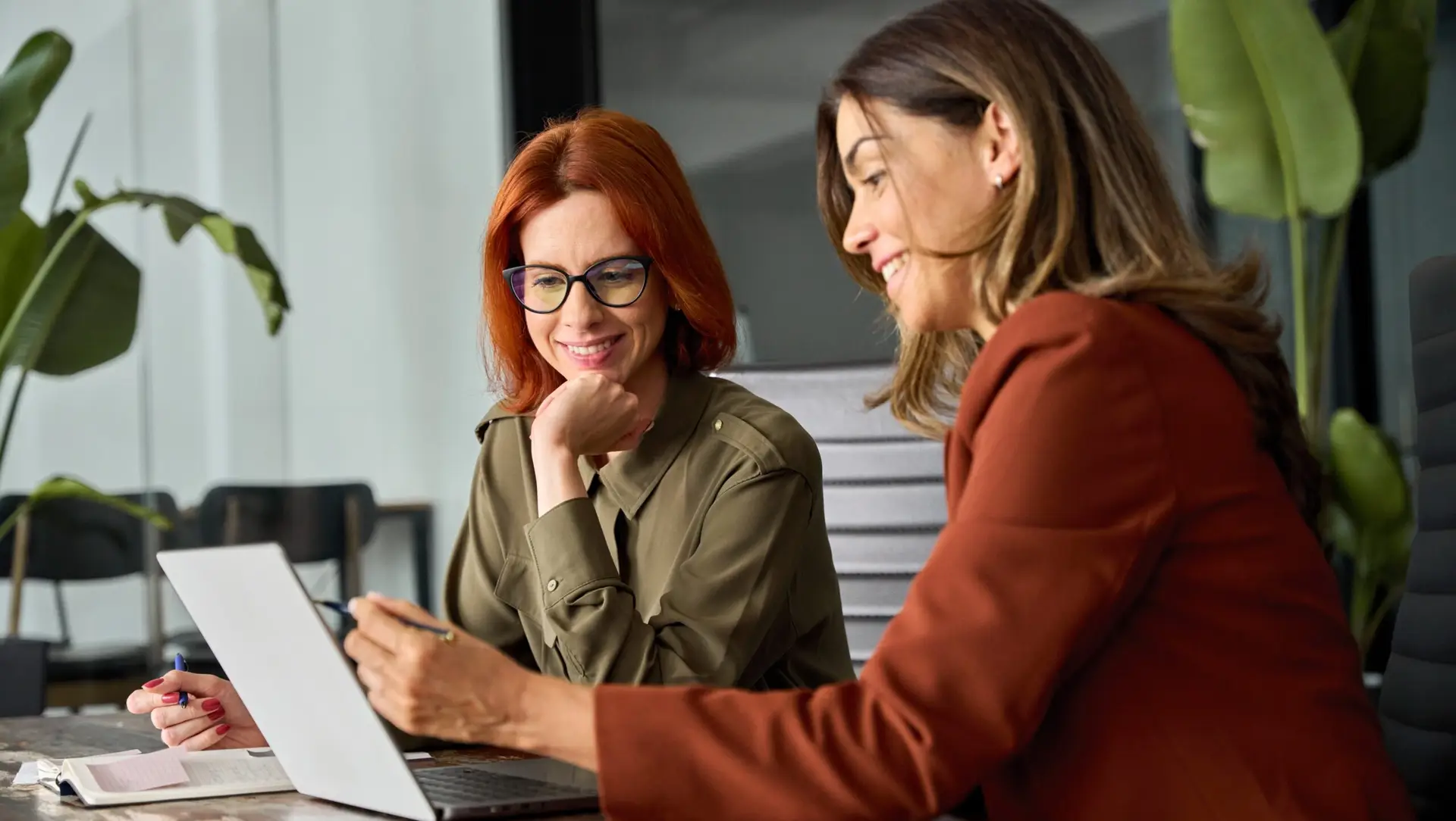 two women studying a tiktok trend on a computer