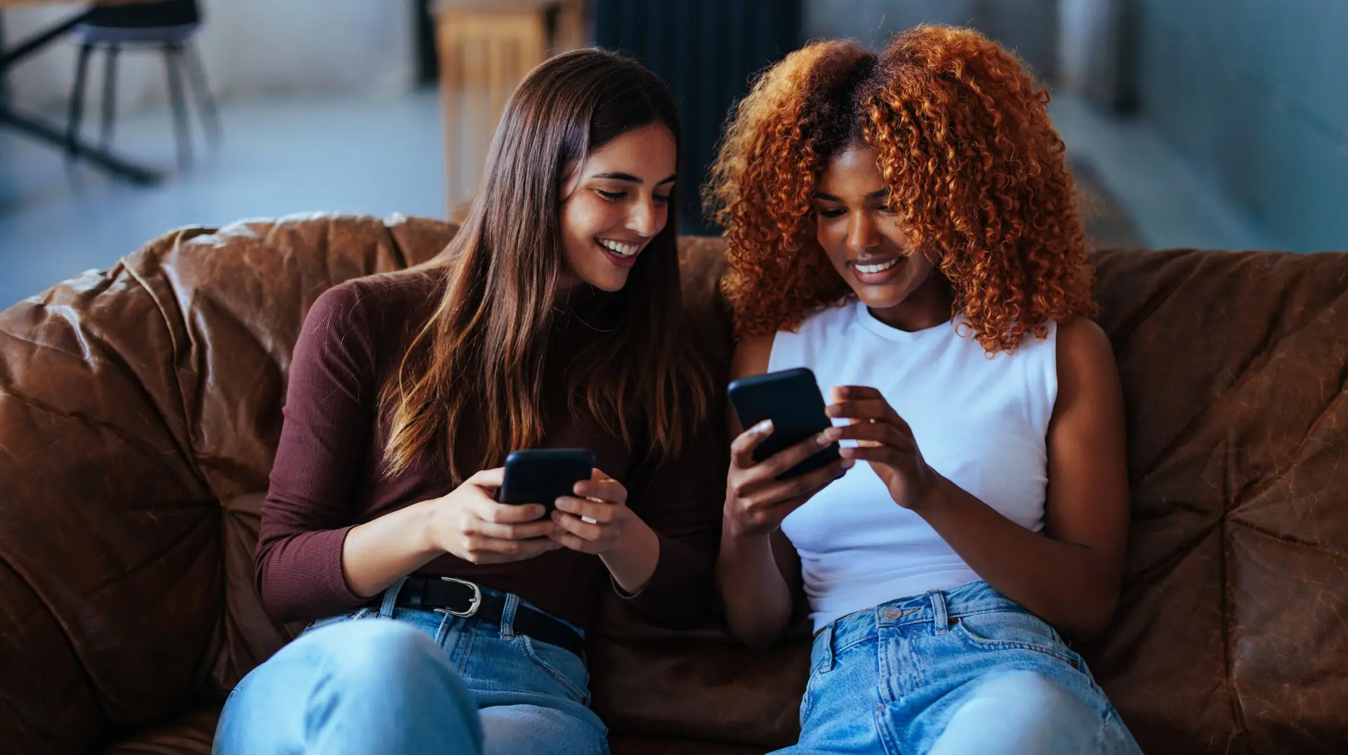 2 woman on their phones watching social media trends