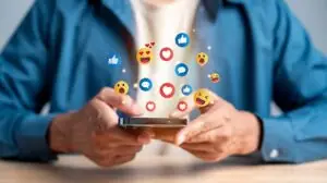 man on his phone looking at social media trends