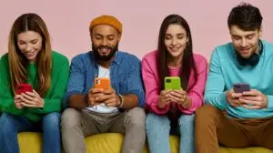 4 social media influencers on their phones