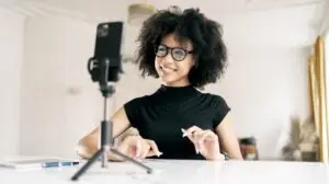 Woman coach recording a short-form video on her phone