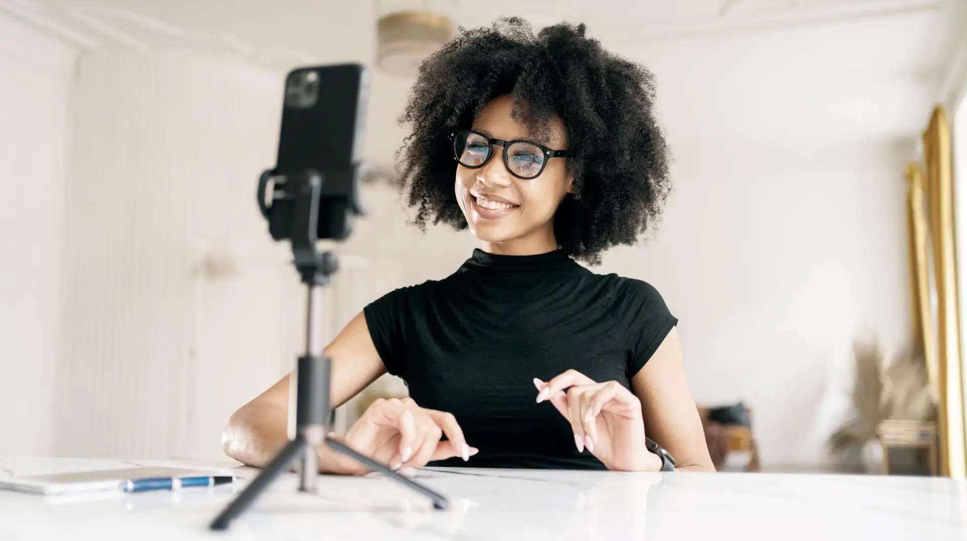 Woman coach recording a short-form video on her phone