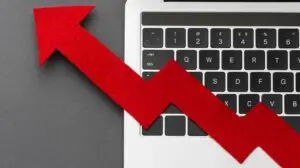 Red arrow going up backwards, implying overspending on ads