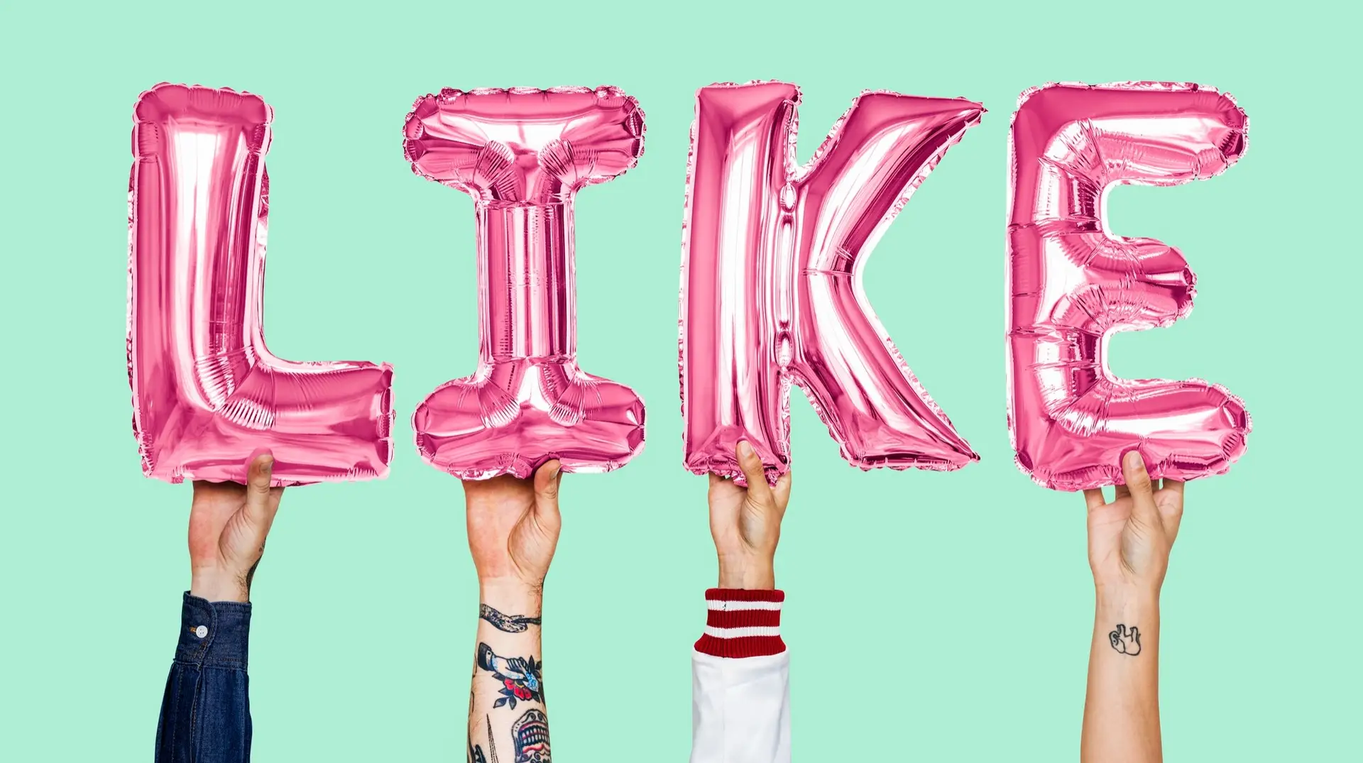 TikTok influencers holding up letters spelling out the word "like"