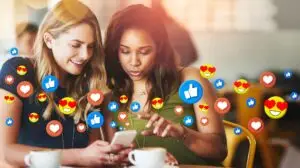 Two marketers checking social media engagement