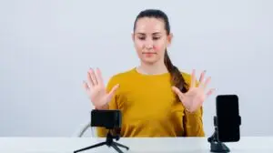 Woman showing the stop hand gesture with both hands