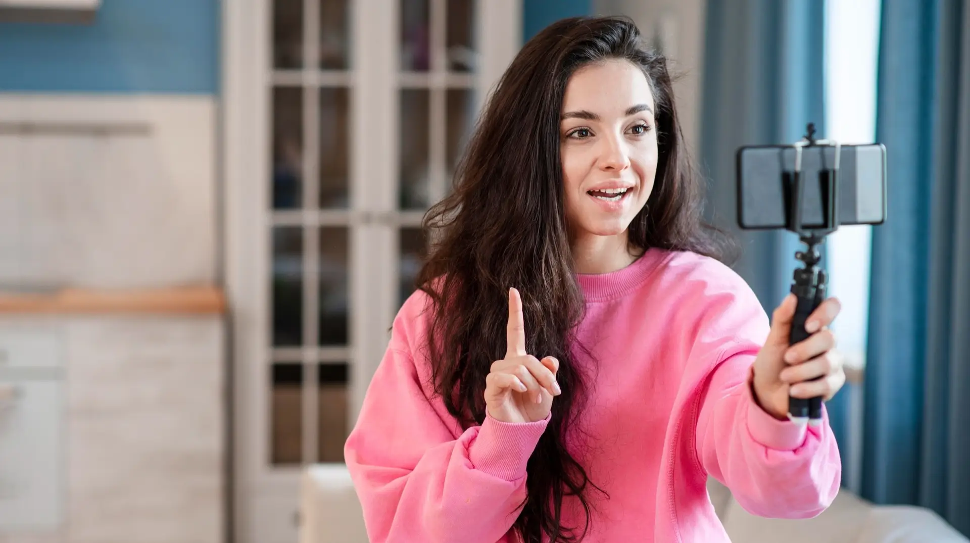 Woman recording a YouTube Short using the 'This Is Faster' hook