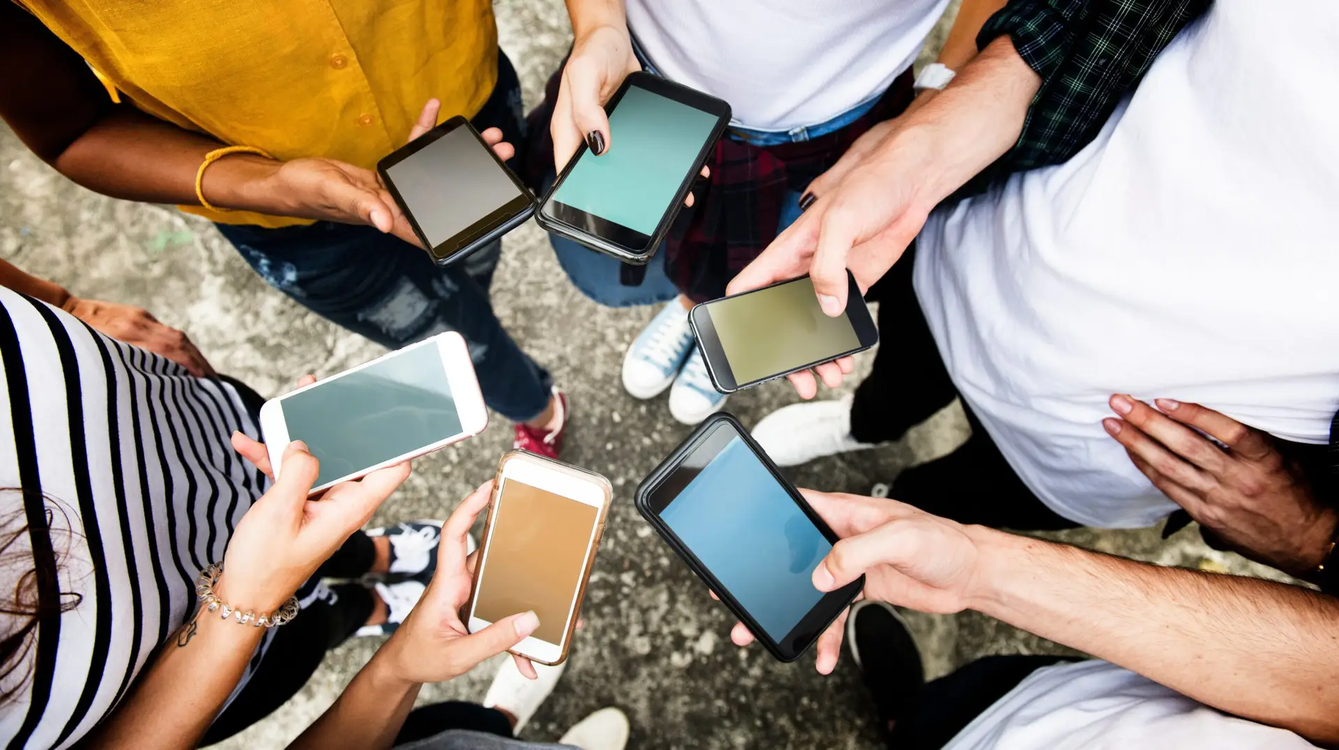 group of people passing the phone