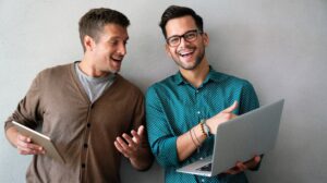 2 men with computers