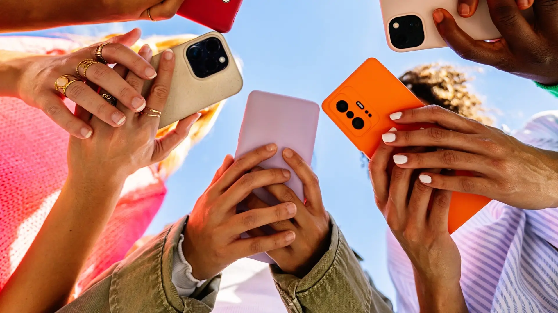 group of people watching social media trends on their phones