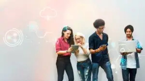 A group of marketers looking at their phones and tablets