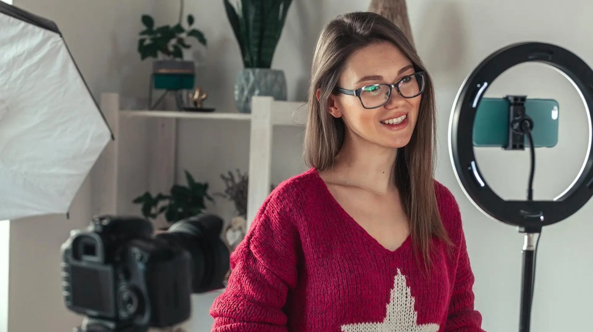 A woman recording a short-form video to promote her course